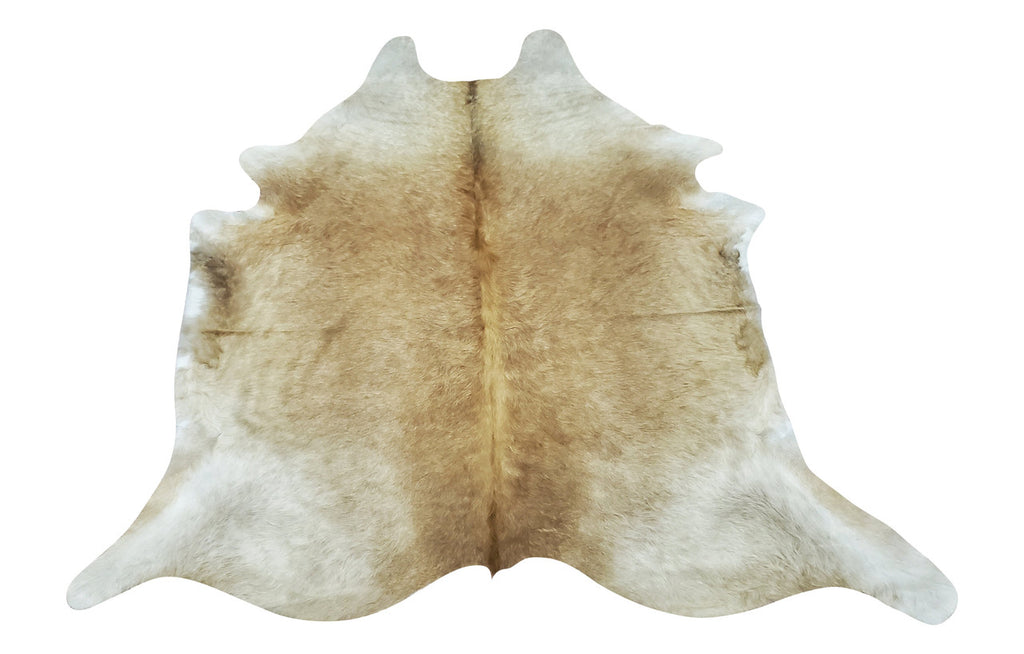 A unique cowhide rug is a stunning natural mix of taupe and palomino, soft and smooth great for neutral space