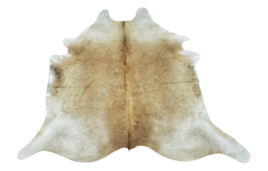 A unique cowhide rug is a stunning natural mix of taupe and palomino, soft and smooth great for neutral space