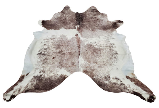 Give your space a touch of coziness with our natural long hair cowhide rug in large size and exotic brown white for western charm