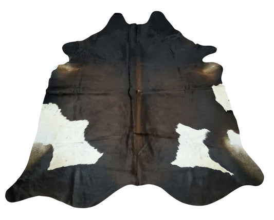 Exotic large cowhide rugs when placed in your dining room or fireplace decor can be game changer, very soft and smooth with natural dark rich tones.
