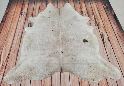 Large cowhide rug in Dawson Creek stunning speckled light grey with black tan mark hundred percent natural and unique. 