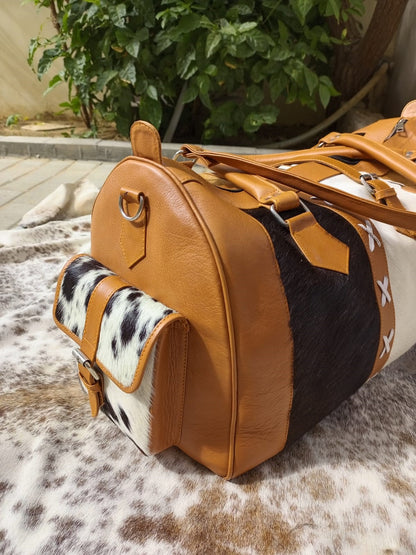 Elevate your travel style with a custom cowhide duffle bag. Crafted for backpacking and weekend getaways, it's the perfect stylish travel companion.