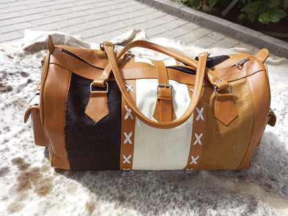 Upgrade your travel style with a custom cowhide duffle bag. Tailored for backpacking and weekend getaways, it's the ultimate blend of fashion and function.