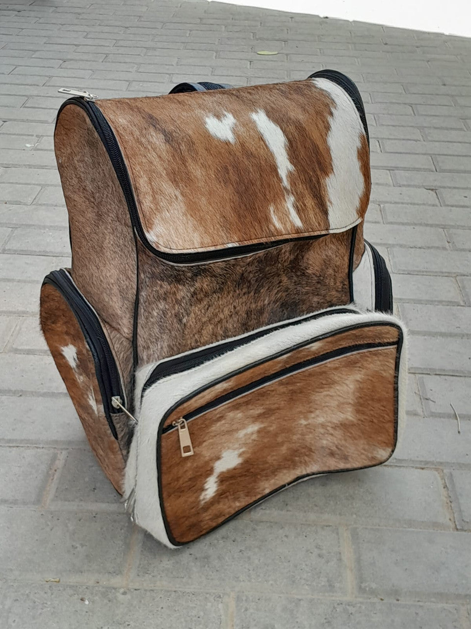 Experience the ultimate in style and durability with our cowhide backpacks. Shop now to add a touch of sophistication to your look.