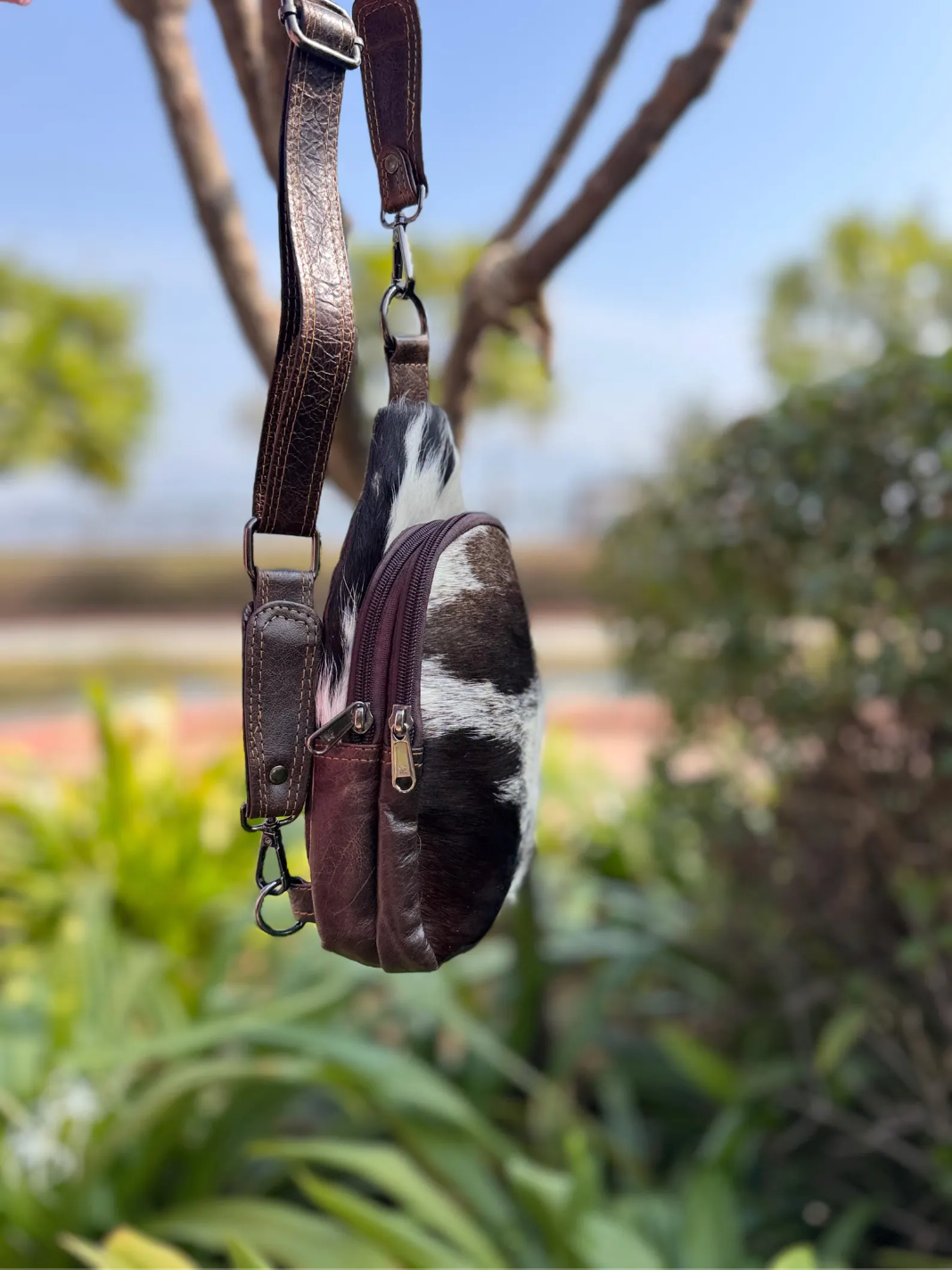 Cowhide sling bag with adjustable leather shoulder strap