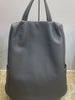 Women leather tote bag with backpack straps, large interior space, clean shape for work, school, and trips