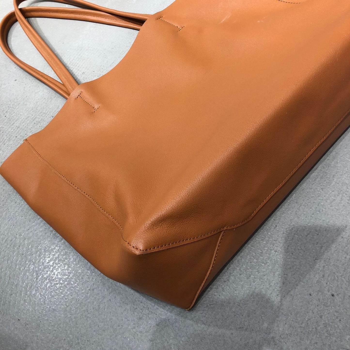 Everyday women leather tote bag with simple silhouette and spacious open compartment