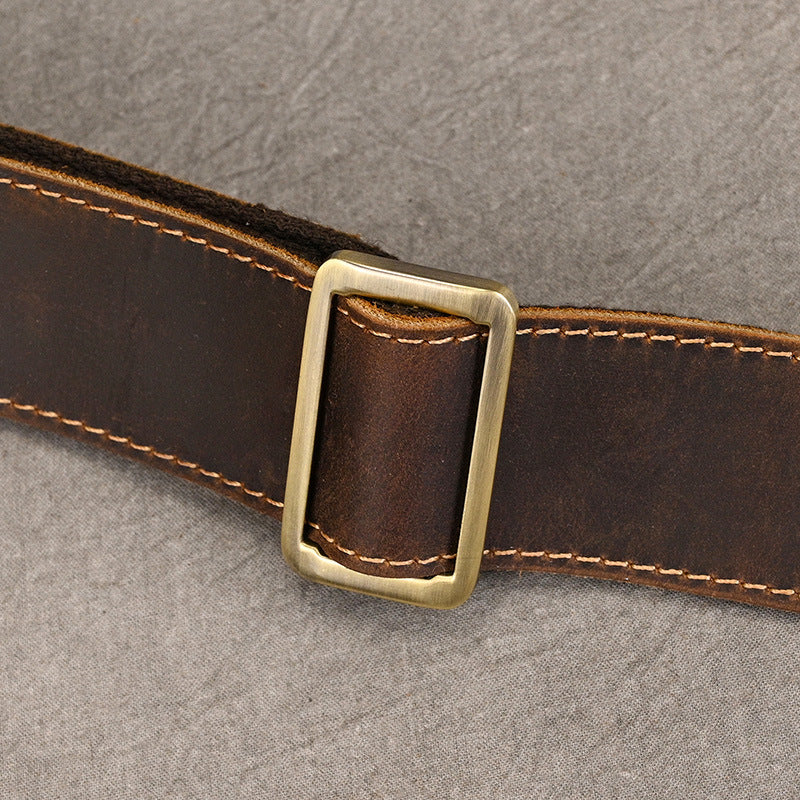 Rustic leather duffel bag offering spacious storage and reinforced handle support