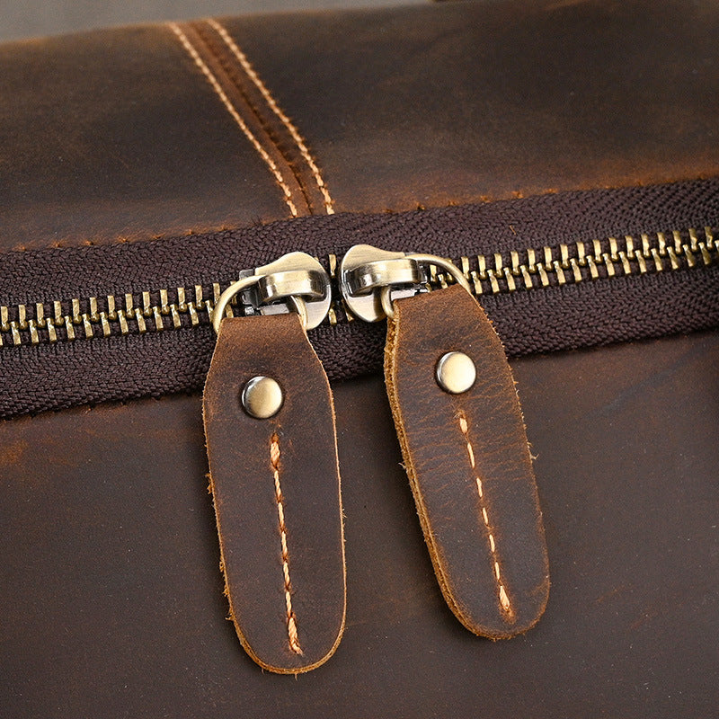 Men's leather duffel bag built for business travel and overnight packing efficiency