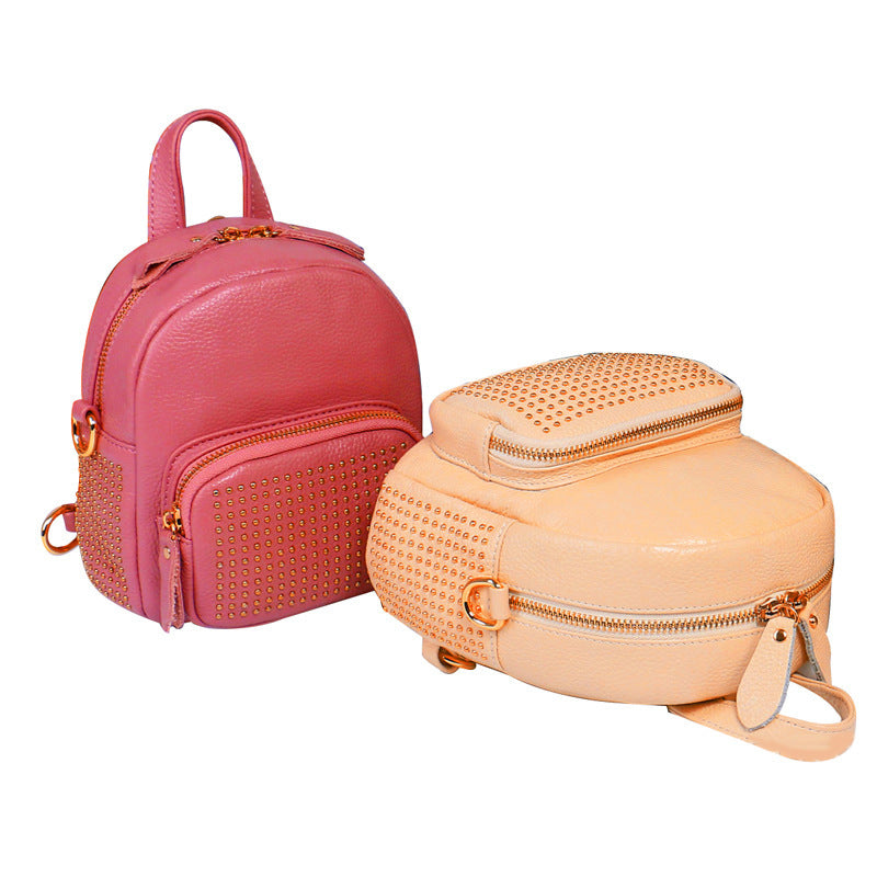 Pink studded top-grain leather mini backpack