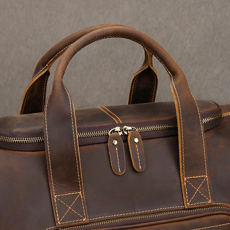 Full grain leather travel duffel with adjustable shoulder strap and balanced structure