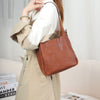Soft brown leather messenger bag for women