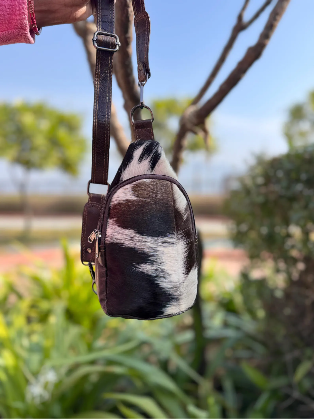 Cowhide sling bag with adjustable leather shoulder strap