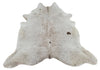 A speckled cowhide rug with some solid spot with grey and white, this is a stunning hide rug in salt and pepper. 