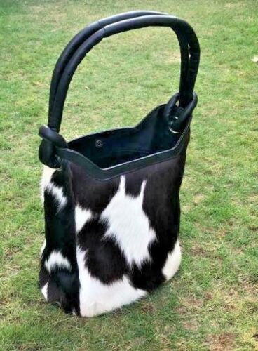 The cowhide bag is perfect for carrying your essentials, whether you're going to the office or out on a date.