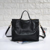 Womens leather handbag crossbody bag made from cowhide with structured shape and organized interior