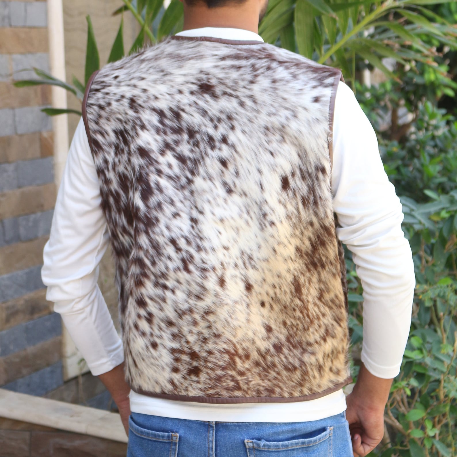 Real cowhide vest mens option with adjustable sides, four outer pockets, and a classic western design—great addition to denim or flannel outfits.