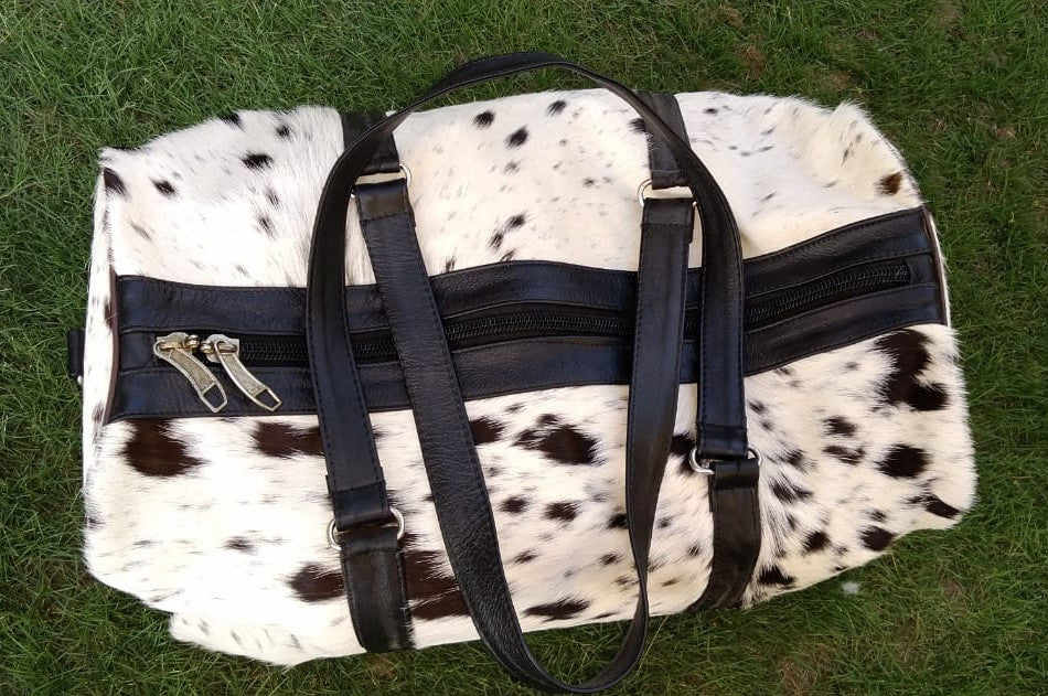 This cow skin leather bag is amazing The cowhide is beautiful. Craftsmanship is great comes with brand