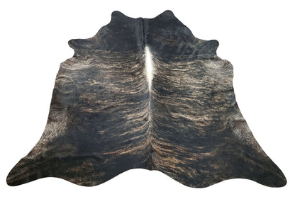 The brindle cowhide rug you will get is even more beautiful than the picture! Vibrant colors, hand finished to tell a story, and it fits perfectly in any space