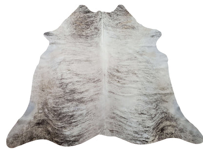 This grey brindle cowhide rug is softer and more pleasing than you can imagine, and the gray is wonderfully radiant, all natural, genuine, and comfortable for any space.
