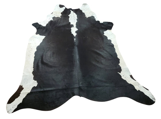 A Holstein cowhide rug in classic black and white spotted pattern for your home seems to go with the modern look that the designer wants to achieve. 
