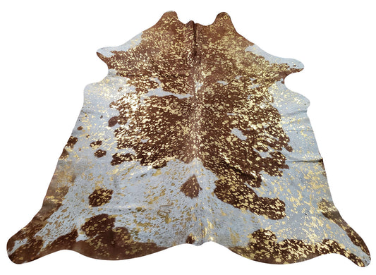 From mid-century to contemporary decor,  beautiful gold metallic on brown white cowhide rugs are perfect in atmosphere and bridges the over all style of the space. 
