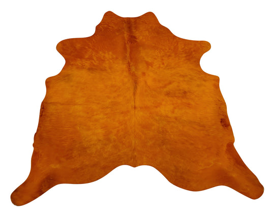 A coffee table and dyed cowhide rug in orange is what your decor need, very easy to clean and hard to stain. 