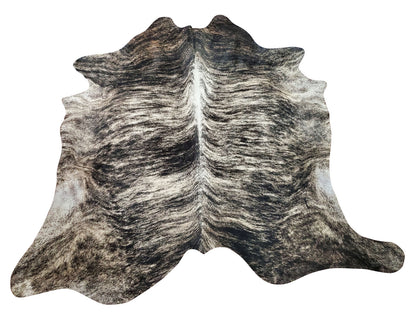 This large dark cowhide rug will transform any room into something special, the exotic gray with some black looks like it's divine in virtually any space.
