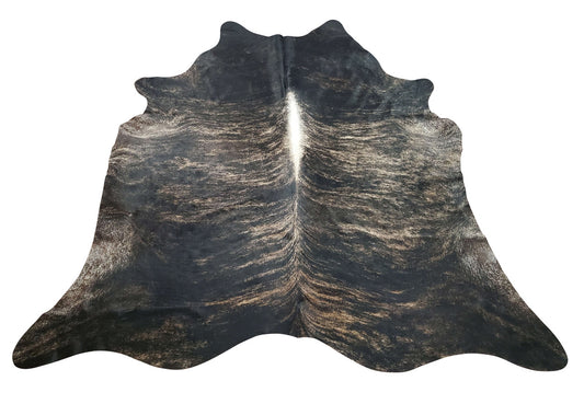 An exotic cowhide rug dark brindle adds a bit of charm and playfulness to a modern kitchen or living room, these stripped patterns are most sought for.
