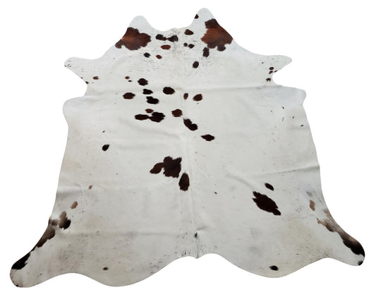 An exotic cowhide rug that will set boundaries and ground your furniture together, add in your entry way or hallway.  

