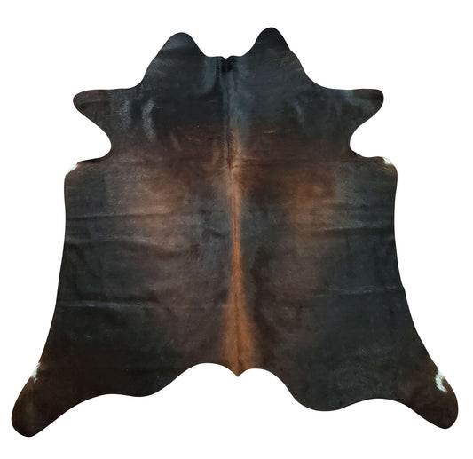 Immerse yourself in absolute comfort with our dark brindle cowhide rugs! These sumptuously soft treasures bring an unmatched tactile experience to your feet as you step onto their supple surface each morning. Their plush texture offers warmth during colder seasons while remaining breathable year-round, creating an inviting environment for relaxation or social gatherings.