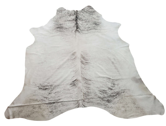Large cowhide rugs are quiet and easy to clean, making them ideal for environments with high traffic. It has a soft mix of gray brindle alongside black and white.
