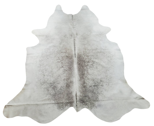 Our exotic Brazilian cowhides rugs are a perfect touch to any living room, office or master bedroom. This cow hide is a mixture of grey with white and some tan. 
