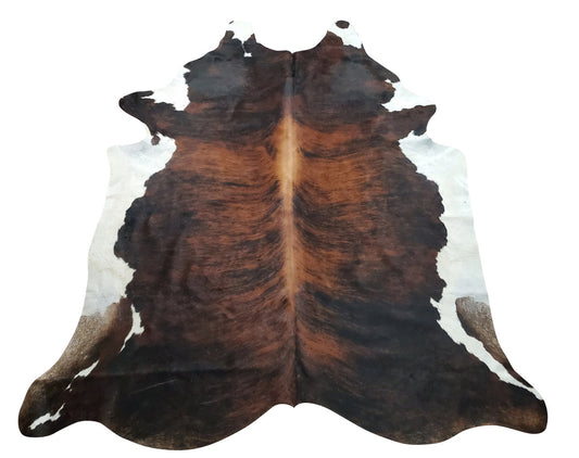 This cowhide rug in stunning dark brown, black and white one of a kind tricolor look will work perfectly in any modern space like living room or entryway, it is handpicked for unique and exotic pattern.  
