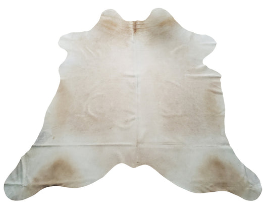 Searching for a cream cowhide rug for your living room, beige and white will pull all the colors and in your room together and pets love cowhide rugs also.
