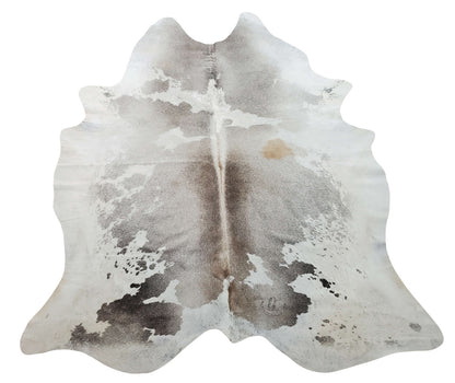 Speckled cowhide rug in grey is designers top choice, handpicked and free shipping all over Canada this cow hide is has very light spots and mostly white.