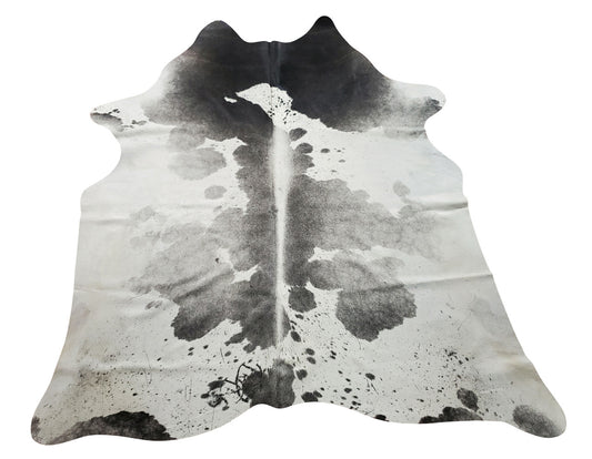 light grey white cowhide rug is a perfect ally to any decor, its contrasting chromatic is easily combined with any colour, further illuminating spaces.
