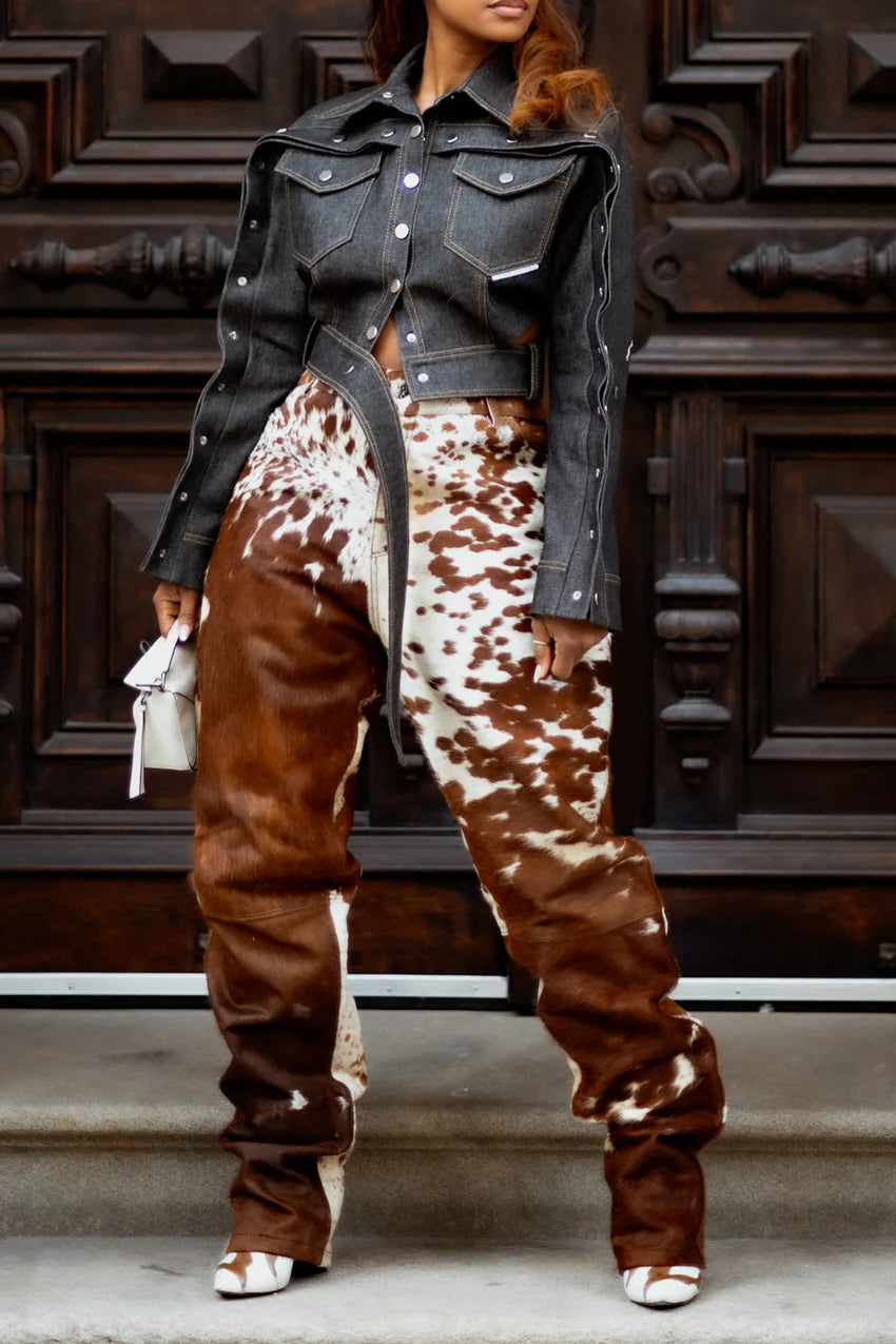 Brown white cowhide pants for women made from genuine hair on hide. Cow print trousers with wide leg cut, perfect for streetwear or rodeo.

