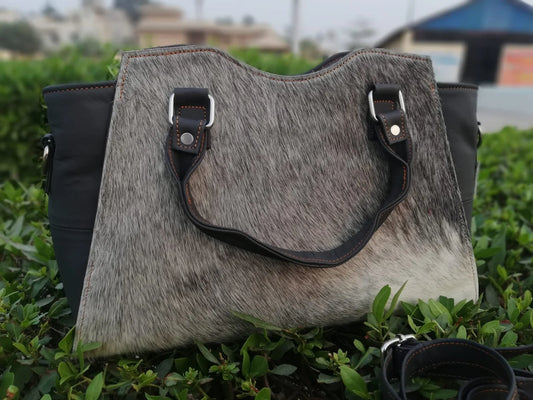 Grey hair on cowhide shoulder bag