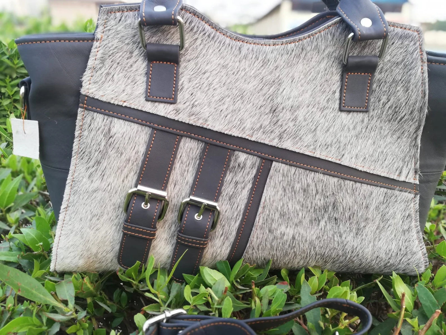 Grey hair on cowhide shoulder bag