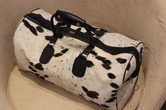 One of its kind handmade cowhide duffle bag. 