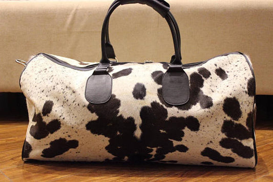 Very large and beautiful hair on cowhide bag. 
