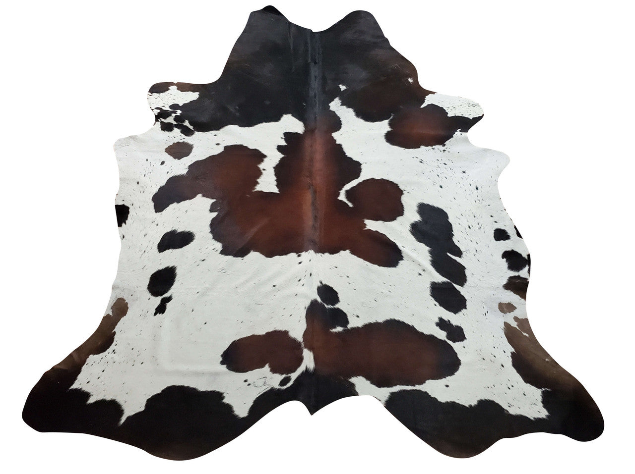 This cowhide rug with natural marking in brown white tricolor super interesting and unique, makes a statement, without overpowering the room