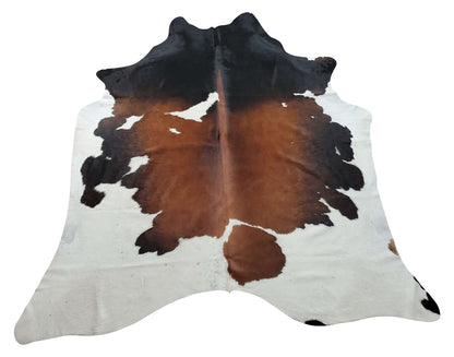 Cowhide rugs in main bedroom has a great potential to transfor the apace—all it takes is a little inspiration of dark brown and some black decor