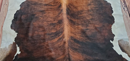 If you're looking for a large cowhide rug that will make a statement in your home, consider a tricolor rug. These rugs are black, brown, and white, giving them a unique look that will stand out in any room.