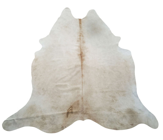 This beige cowhide rug is absolutely lovely, its feels so nice under the feet, real skill and artistry has gone into finished this natural piece. 