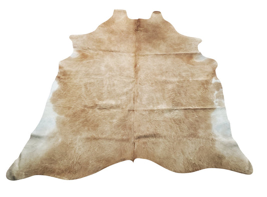 Add this beautiful light brown tan cowhide rug to give your room a touch of industrial charm. 
