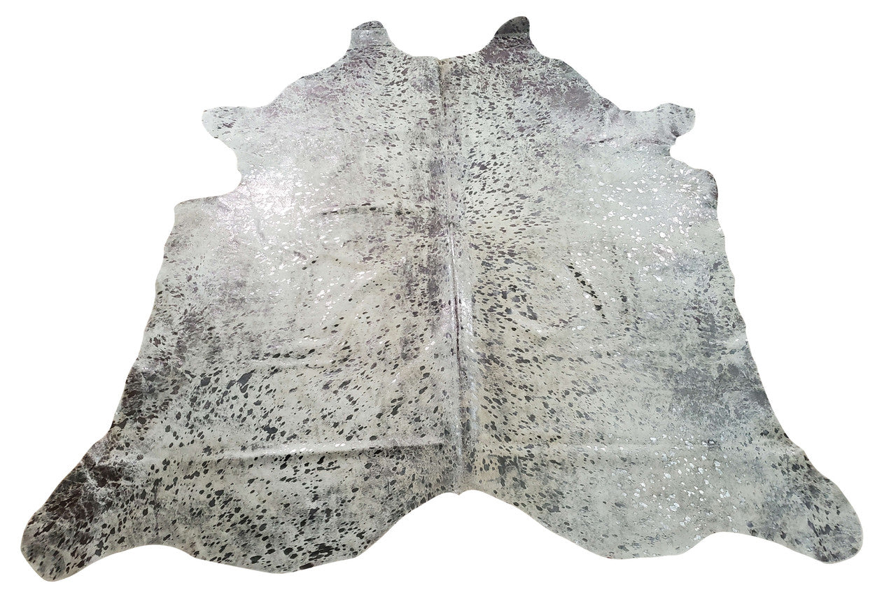 metallic cowhide rug in stunning silver grey is one of the most confident decorating choices of interior designers and  it is a big pay off in any home. 
