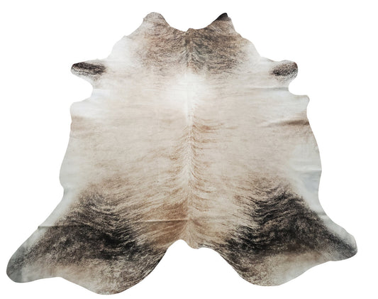If you are looking for a minimalistic touch to any space, brindle cowhide rugs can be perfect it is a mix of neutral colors and a little bit darker on the edges. 