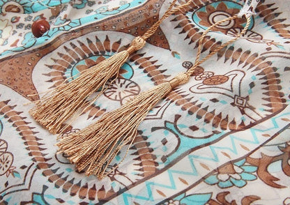 Floral maxi dress with turquoise tassel neckline